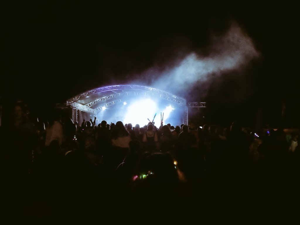 GGCaernarfonsh's tweet photo. We've had a day of funny weather, but after a rather heavy shower, we're enjoying tonight's performances in the dry. We're got our glitter and glow sticks on, ready to dance, sing, and scream the night away!🎶 @WaddowHall @Girlguiding @GuidingCymru #welliesandwristbands https://t.co/WA26wbTv8P