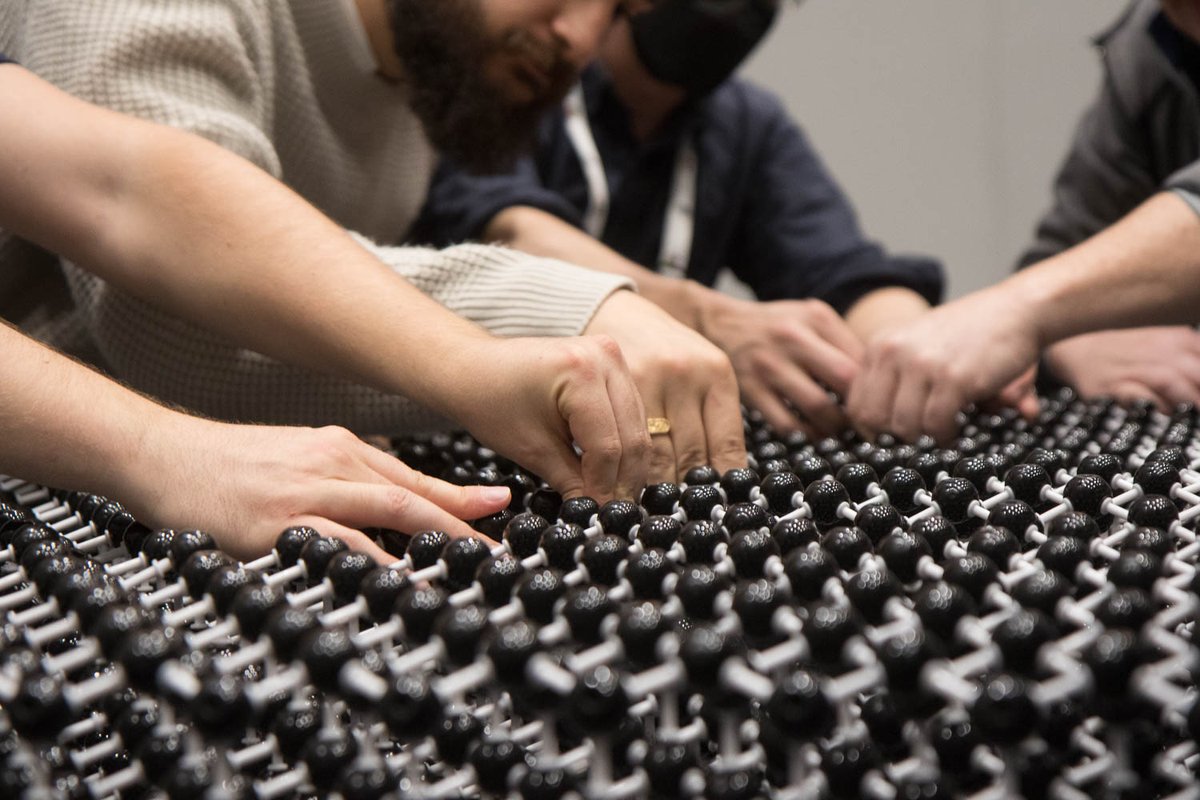 JunAishima's tweet photo. "Many hands make light work" - many people helped put together the world's biggest diamond structure for #braggYourPattern, here are some photos of the final steps! Come see it in the exhibition center early on Sunday before it gets dismantled for transport! @IUCr2023 https://t.co/Pc3vCMN6QE
