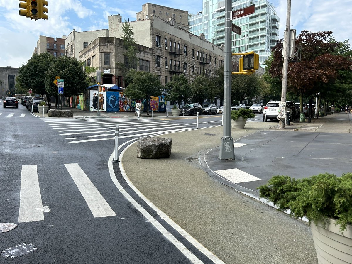 MikeLydon's tweet photo. Low cost. Low maintenance. Sittable. The most under-appreciated/underused item in the Quick-Build material palette is the boulder. The new Underhill Bike Blvd strategically uses them to define/reinforce new pedestrian and bike space, and to prevent reduce vehicular incursion. https://t.co/D7vz2pFGEy