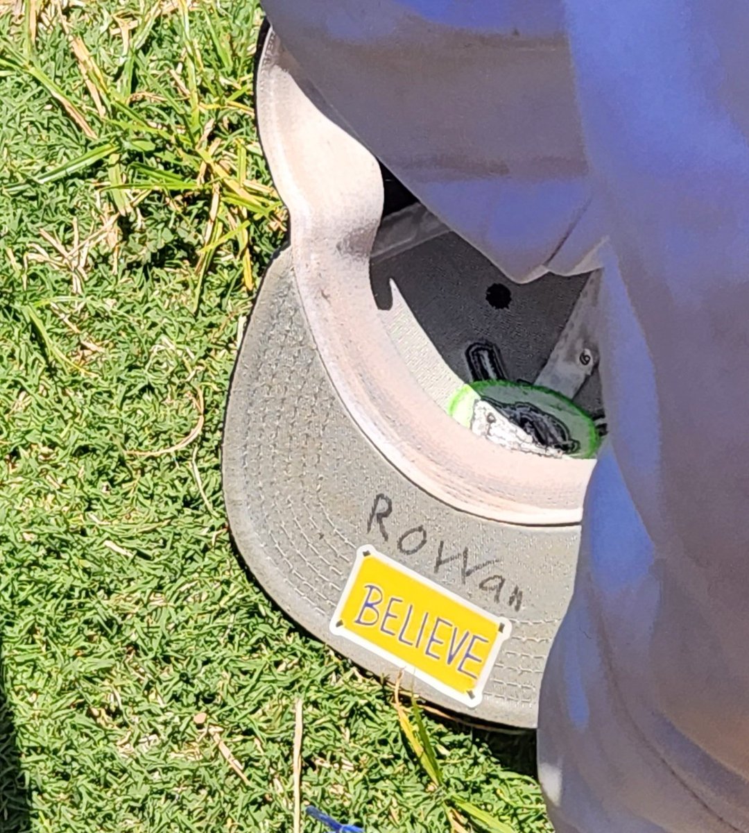 Akorenak's tweet photo. Believe sign spotted in the wild on my 10yr old son's baseball hat. He said he looks at it when he needs to take a breath and reset. Much love Ted Lasso fam, thanks for everything. @jasonsudeikis @brendanhunting @hanwaddingham #Believe #tedlasso https://t.co/zIwKbUZ9xJ