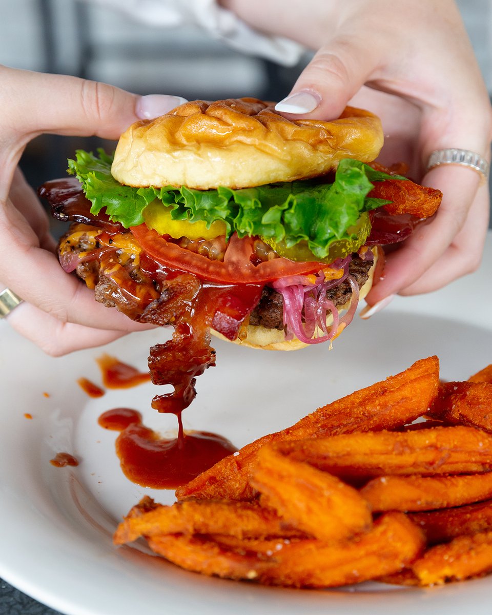 Rain or shine outside of the restaurant, it's always drizzling when you order our Pedigree burger.  Order delicious beef burger is topped with shredded cheddar and Applewood smoked bacon, then dribbled with our mouthwatering BBQ sauce.