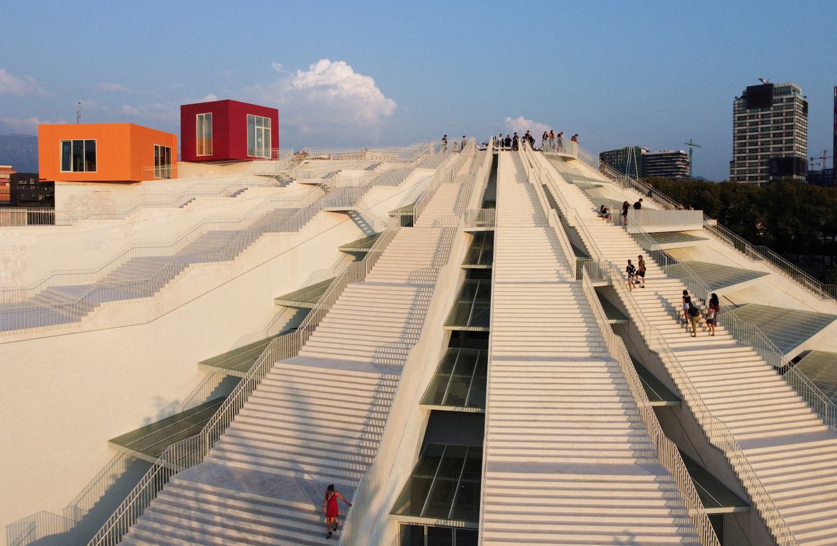 Tourists visit the redesigned pyramid that was formerly a museum for the late dictator Enver Hoxha in Tirana, Albania on August 23. Photos by Florion Goga/Reuters