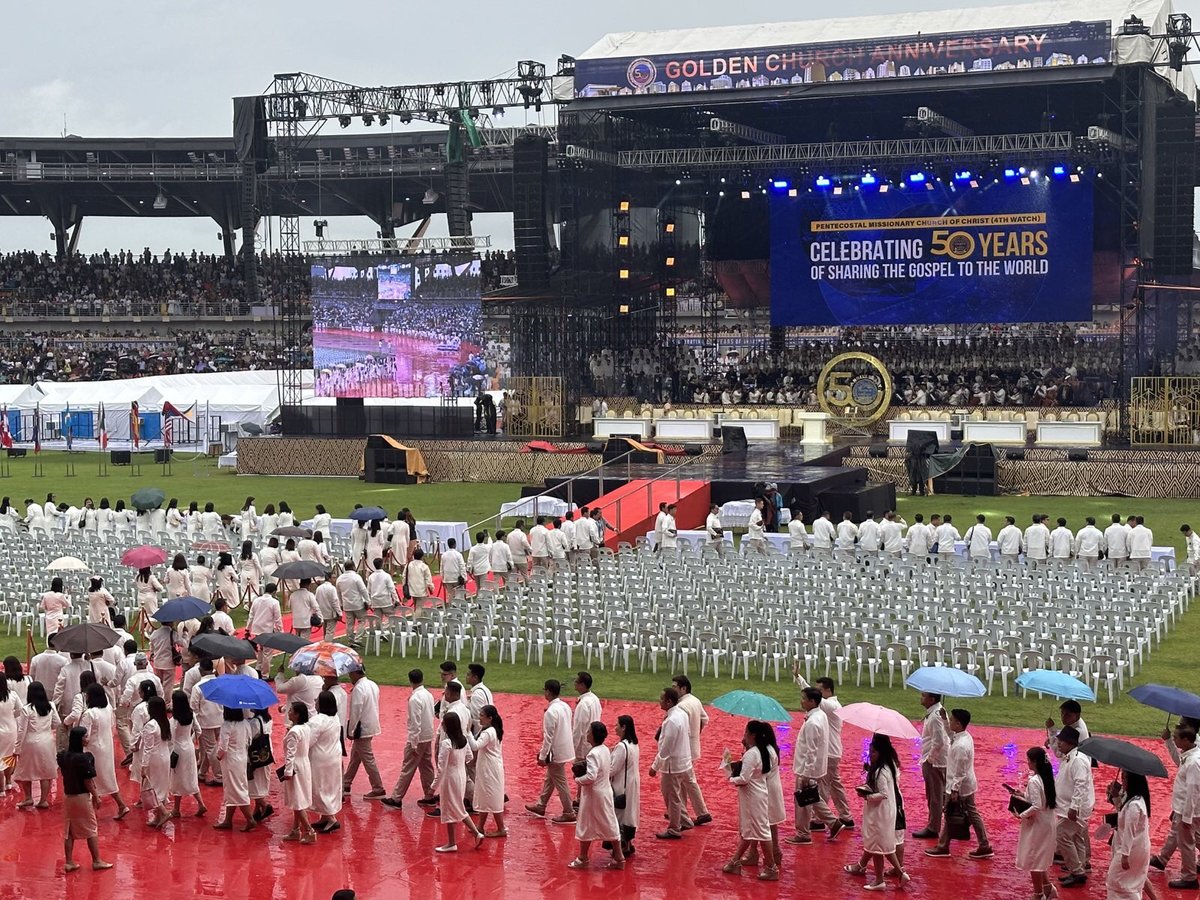 rapplerdotcom's tweet photo. HAPPENING NOW: #PMCC4W kicks off its Golden Anniversary Celebration at the New Clark City Athletics Stadium with a parade of colors led by leaders, Apostle Arsenio T. Ferriol and  Bishop Jonathan S. Ferriol. 

Follow this thread for updates on 
#PMCC4W50thAnniversary 👇#BrandRap https://t.co/BFWgLO9M4l