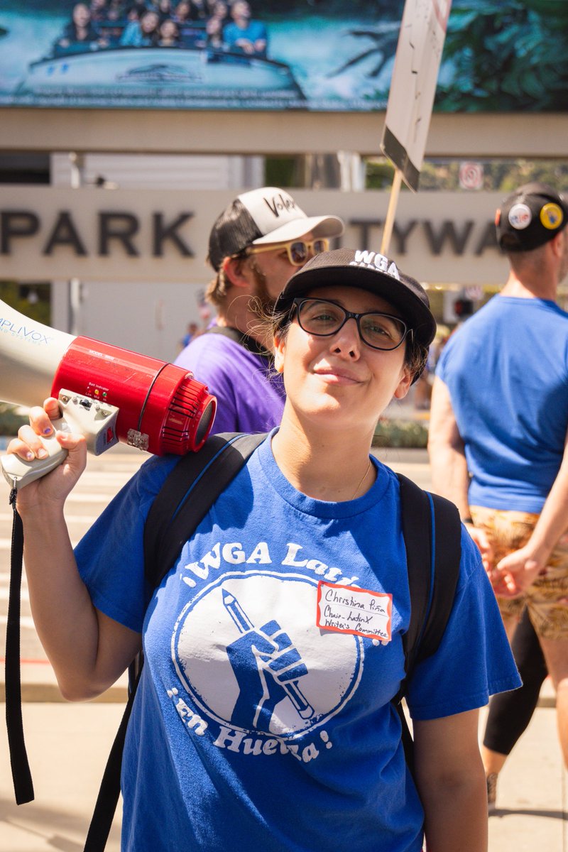 Meet #WGACaptain and Chair of the Latinx Committee @aka_mselectric, writer on LAW &amp; ORDER, ORGANIZED CRIME. Why she's striking: For better representation of all cultures, peoples, and ethnicities, and so we can get paid well while we continue to do this. #WGAStrike #WGAStrong