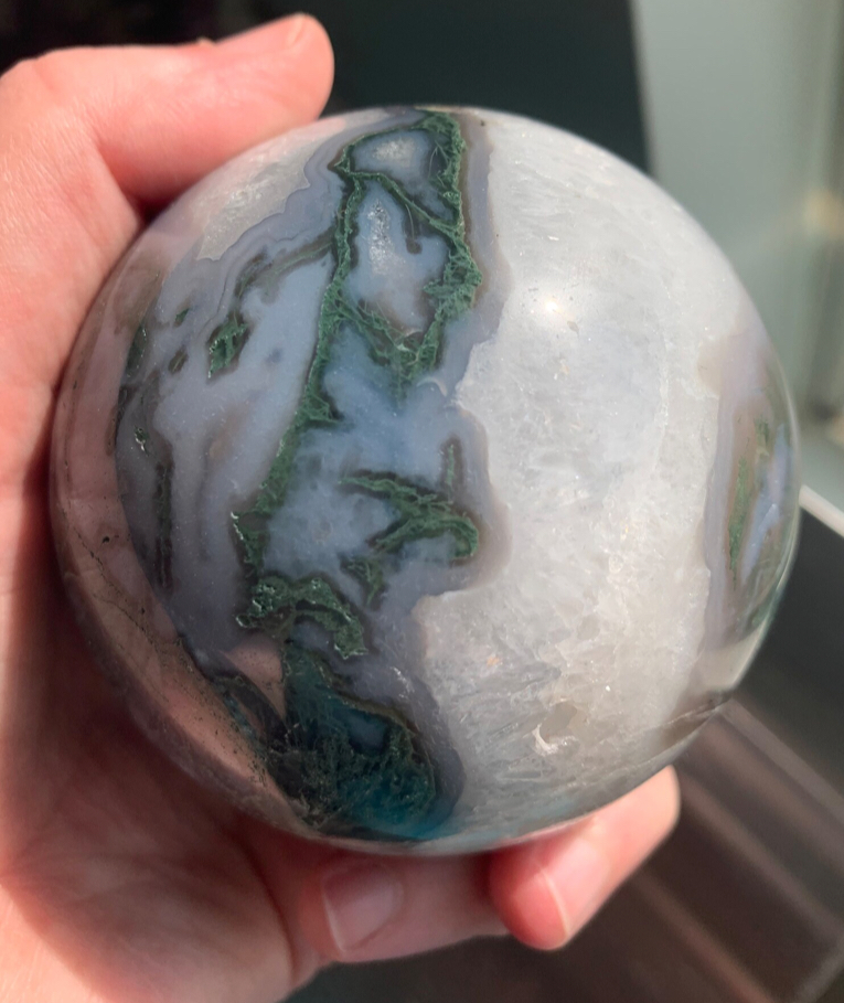 Fellow rock nerds! This beautiful moss agate sphere with blue chalcedony, white quartz, &amp; multiple druzy pockets in now listed in my shop. Reminds me of rivers, forests &amp; snow.  Only letting it go because I have too much moss agate in my collection (I LOVE IT). Link in bio.💚