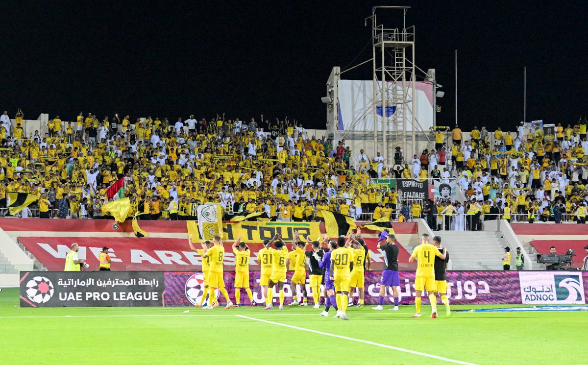 UAEProleague_En's tweet photo. 📷l The celebrations continue! @AlWaslSC players join the fans in marking their triumph over Sharjah 🎉⚽
#SHJvWSL ⚪🟡
#ADNOCProLeague ⚽
#FansLeague 🗣️
#FairPlayFairSupport 🤝 https://t.co/iJQdr8Qum5