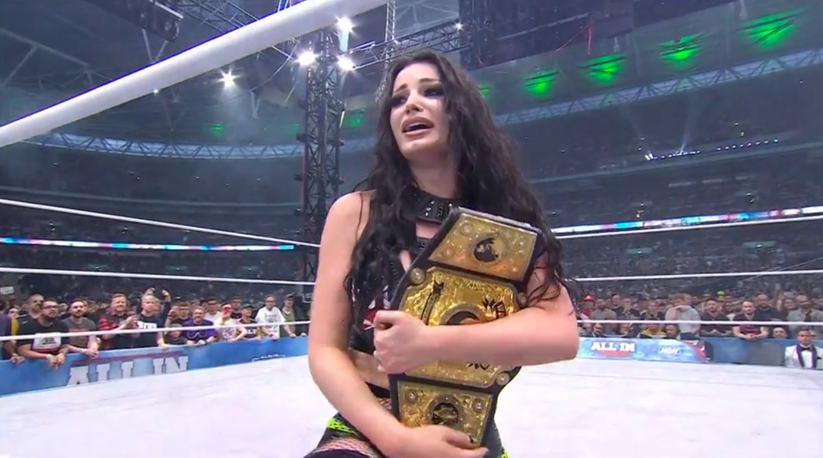 WrestlingNewsCo's tweet photo. Here career was supposedly over a few years ago after her neck issues and now she's World Champion in front of her family and 80,000 people. #AEWALLIN https://t.co/uNx2mNuRGJ
