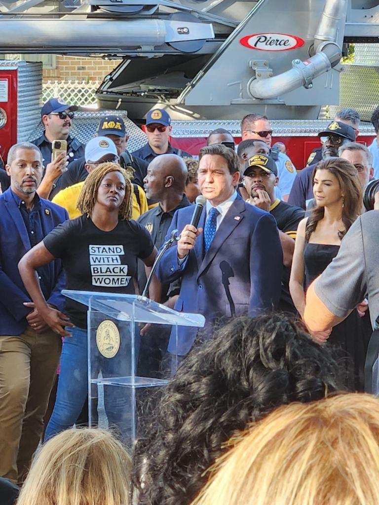 Black leaders built a vigil today to honor the three Black lives lost in Jacksonville to gun violence yesterday.

Gov DeSantis took advantage of THEIR space after banning Black history, banning diversity, and more.

This powerful photo of Rep. <a href="/AngieNixon/">State Rep. Angie Nixon</a> is all of us.