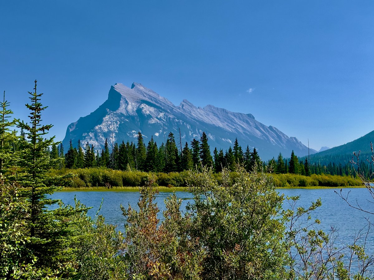 InfiniteZenith's tweet photo. Here's four different angles of #MountRundle at #VermillionLakes in #Banff. Today was actually a smokey sort of day, and in past years, this would've given me some trouble to edit had I shot these as JPGs. With a bit of editing, today didn't seem the least bit smokey 🙃 https://t.co/1qw5vxQf5q