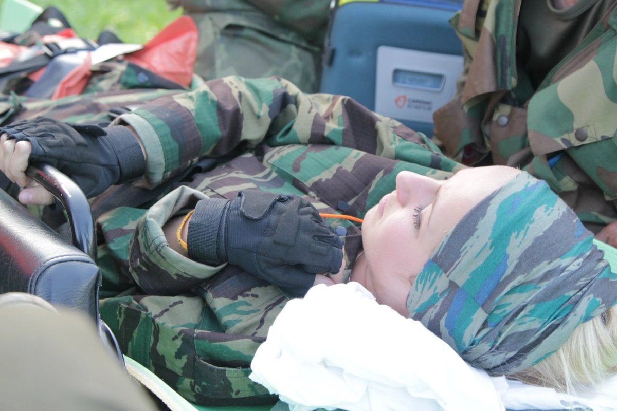 Наш Сергей.. 
даже на учебных эвакуациях был так заботлив к условно пострадавшим
Нам всем его не хватает! 
Фото 2013 года