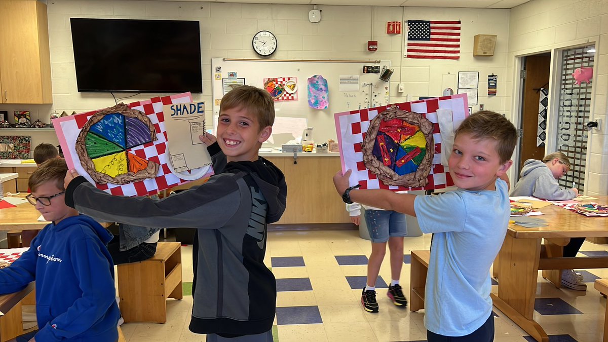 5th grade is learning about the color wheel, making color wheel pizzas.  Complete with placemats, plates, and menus.