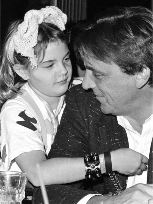 Drew Barrymore was born into a family of Hollywood stars, yet her early years lacked the glitz and glamour. Rising to fame at just five years old with her role in "E.T.: The Extra-Terrestrial," she soon faced the darker aspects of celebrity.

Her father, an abusive alcoholic,