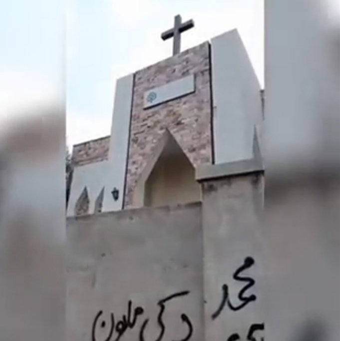 bilalfqi's tweet photo. Goons of #TLP inscribed slogans on the wall of a church (L)  in #Faisalabad's Rehmat Town, a few days after resorting to the same act at Karachi's Central Brooks Church. They must be stopped before it's too late. Report &amp; pic via @kkmediapk. Pic of Karachi church via @zalmayzia https://t.co/DyuSiedEgJ