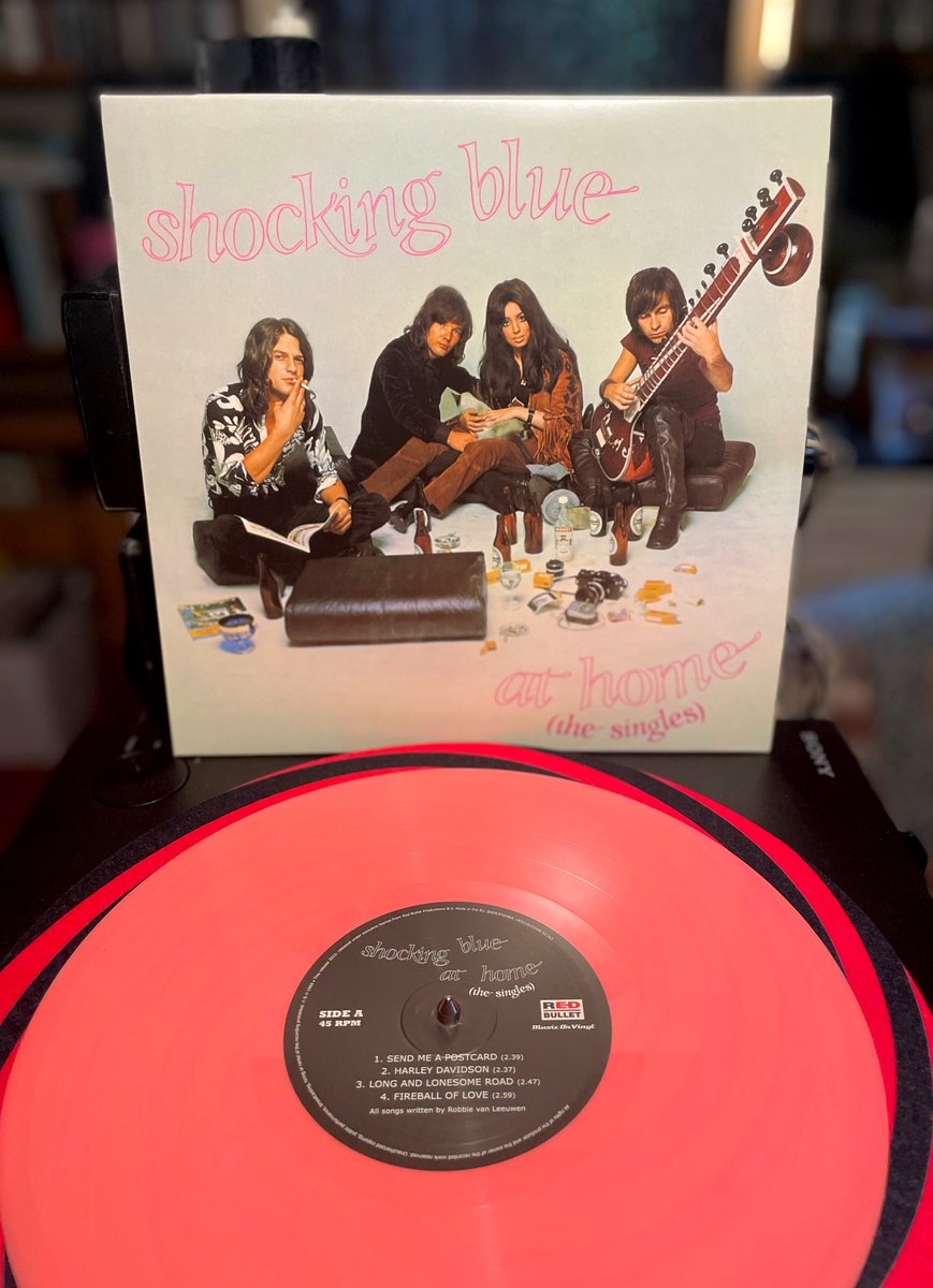 cultdung's tweet photo. SHOCKING BLUE • AT HOME: THE SINGLES
(@MusicOnVinyl / Red Bullet, 2022) Collects mono single A & B-sides from 1968-69. Dutch #psychedelic pop-rock feat. guitarist Robbie van Leeuwen & vocalist Mariska Veres. 45 rpm pink 10" #vinylrecords #RSDDrops #RockSolidAlbumADay2023 240/365 https://t.co/qg8TbRPKCu