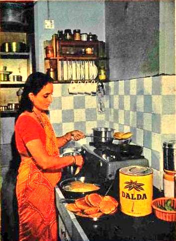 1970s :: Lady In Kitchen Cooking Poories