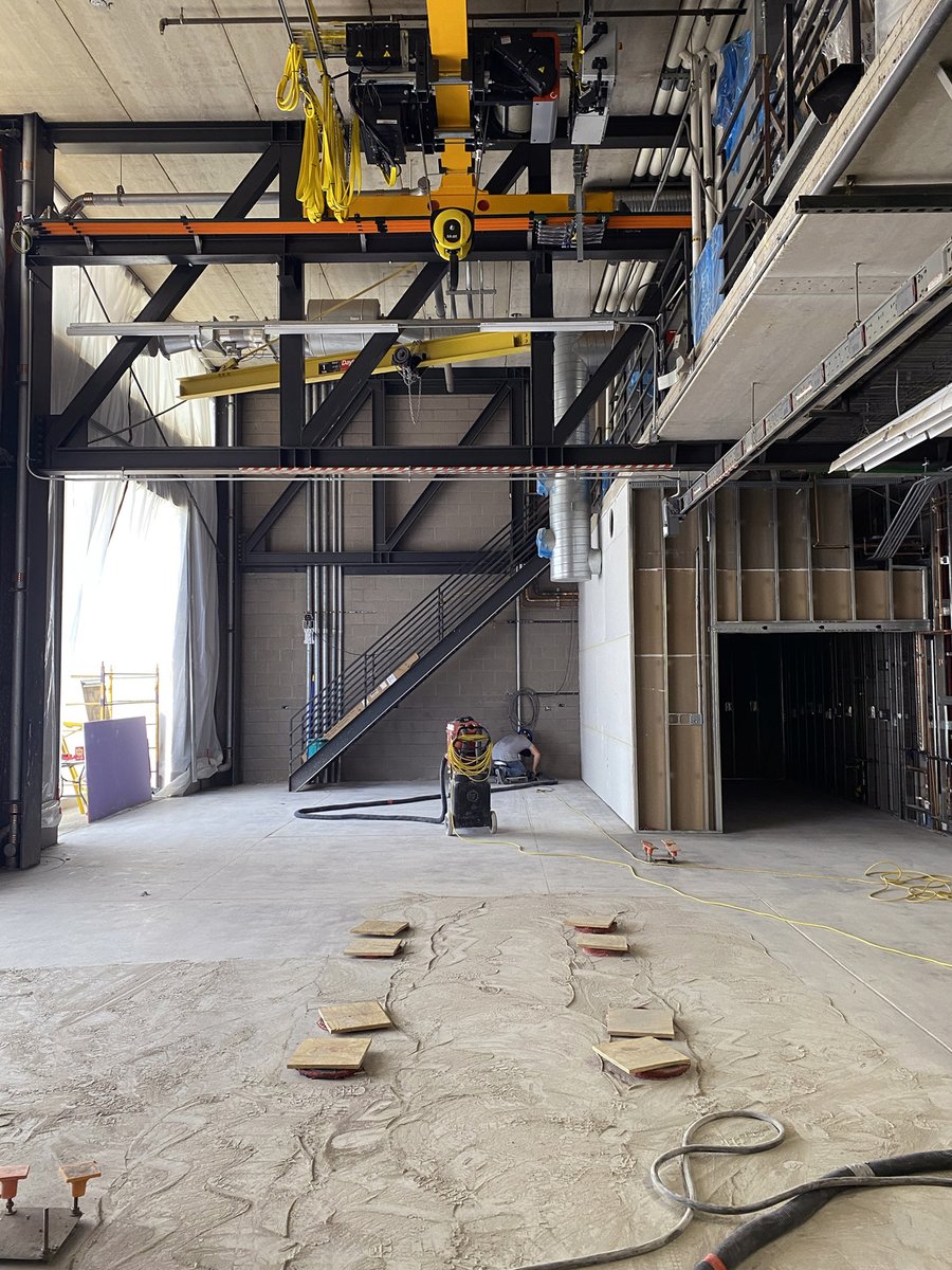 FORCEhighP's tweet photo. Last week our 10 ton bridge crane was commissioned. 20 1000 lb weights were used to load test the crane. Bonus: in one photo you can also see the press hall floors in the process of being smoothed #forceasu #construction #newlab #bridgecrane https://t.co/O2YV6YHJTv