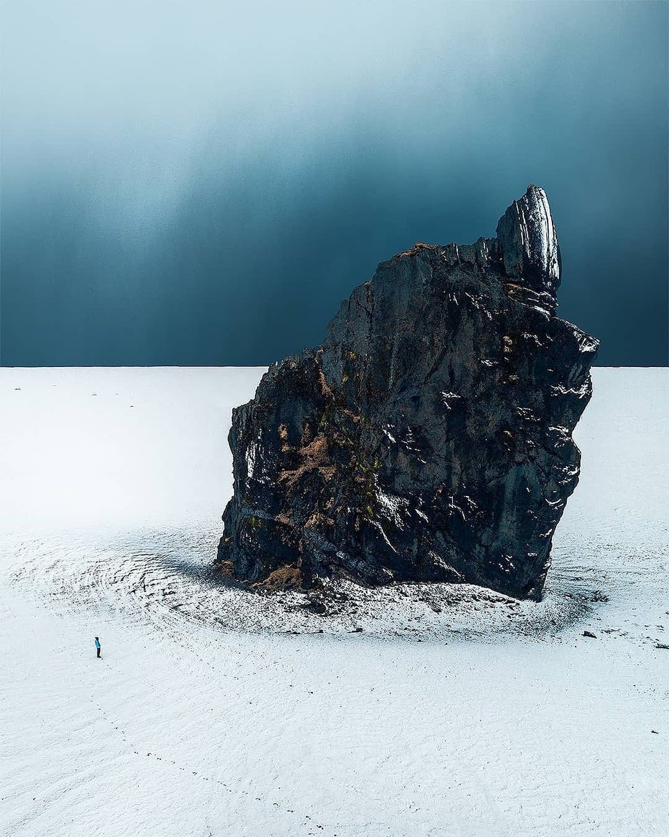 A troll rock stands amidst the icy wasteland 

#Iceland