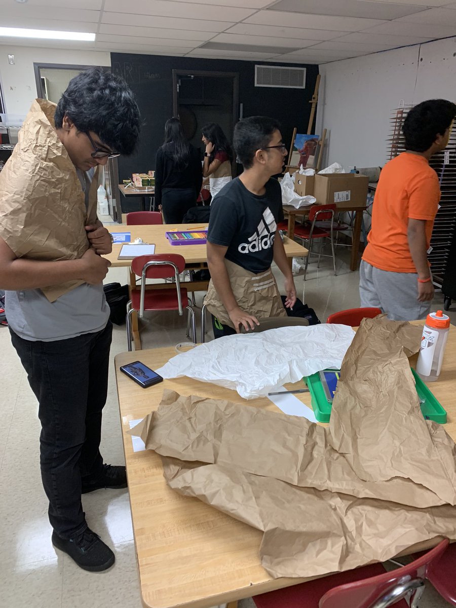KatieHosbach's tweet image. Sophomore students embrace the challenge to create something they can wear using leftover packing paper from my move to IA #creativethinking #iaeast #tsdart #tsdthinkers #designthinking