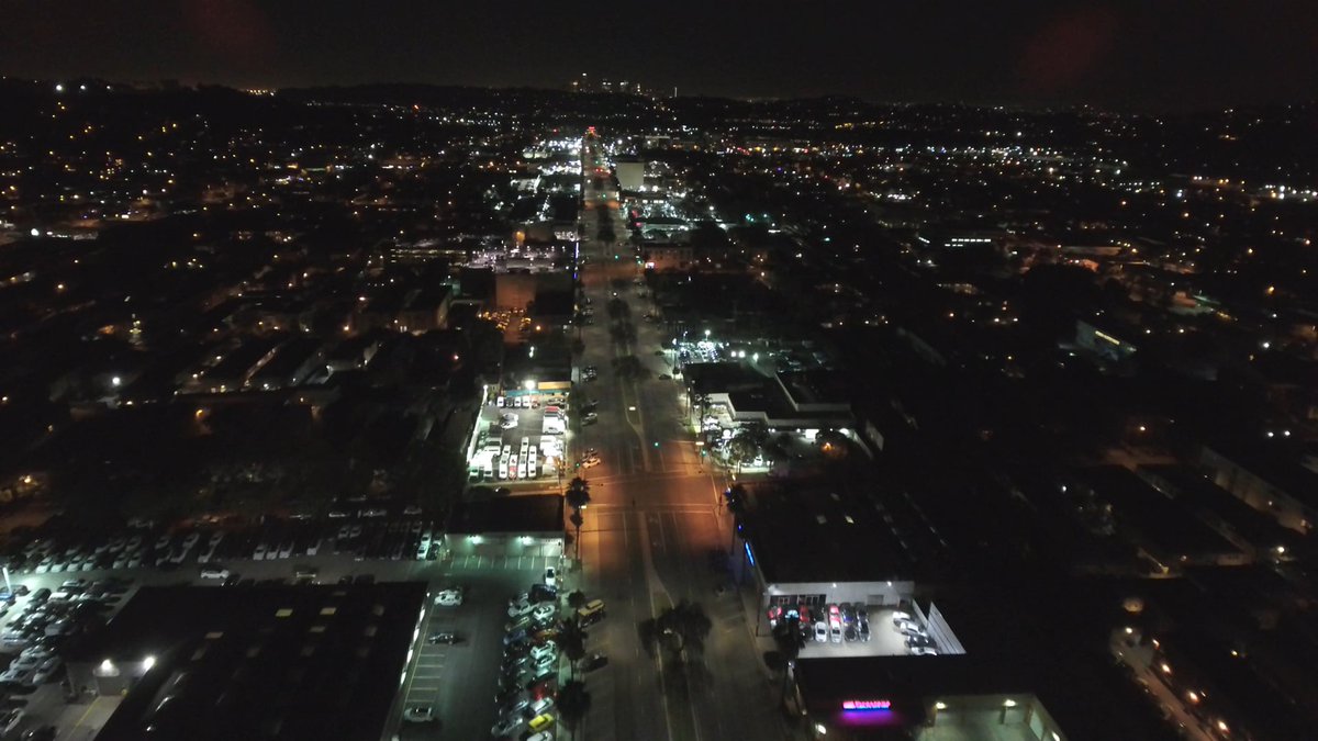 dronestock's tweet photo. Experience the city's nocturnal allure with our free stock drone video of empty streets and dazzling lights. Ideal for urban projects, nightlife promotions, or a mysterious visual ambiance. #drones #stockvideo #citynights View &amp; download here: https://t.co/CnQ44FecH8 https://t.co/ntZCR2iPI9