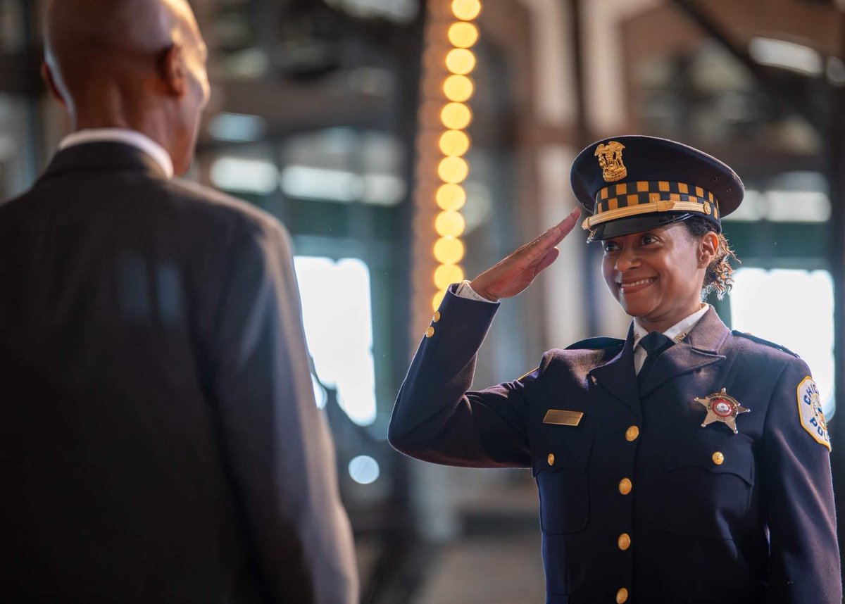 ChiSpectator's tweet photo. Seen today at the CPD promotional ceremony is (now) Captain Nakia Fenner, wife of former superintendent Eddie Johnson. Fenner is reportedly assigned as the captain in the 5th district on Chicago's south side. Fenner was reportedly meritoriously promoted to sergeant and was at the center of a supposed cheating scandal where she (and others) were accused of receiving test answers for the lieutenant's exam. The Office of Inspector General found no wrongdoing concerning those accusations.

According to some officers on the Chicago Police Department, this is a sign of continued nepotism which rewards friends and family of high ranking members.

Captain is an appointed position on the Chicago Police Department.