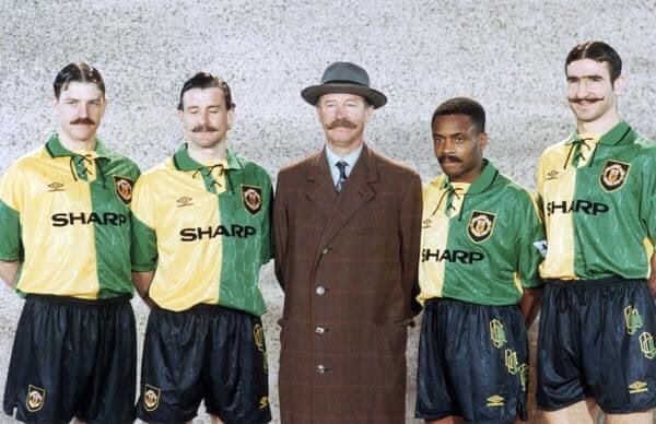 Sharpe, Hughes, Sir Alex, Parker & Cantona wear fake mustaches to promote Manchester United's green and gold away kit used in the 1992-93 season. The uniform was inspired by one worn by the players of Newton Heath, the club that in 1902 would be renamed Manchester United.