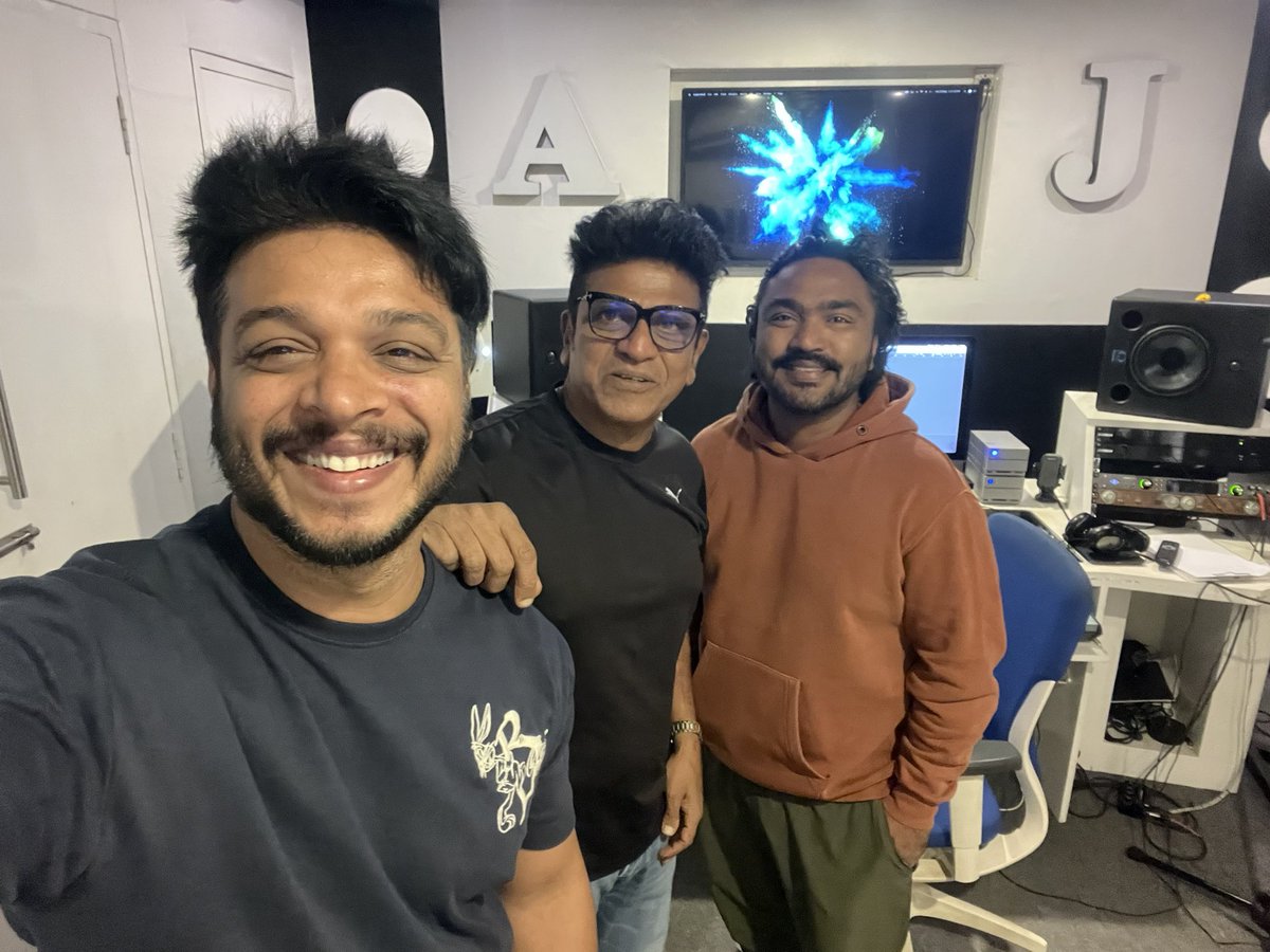 lordmgsrinivas's tweet photo. "Guess who dropped by during our film GHOST's re-recording sessions? The OG himself! 🎬 
#SurpriseVisit" #GHOST 
@NimmaShivanna @ArjunJanyaMusic https://t.co/wl1x6inZRR