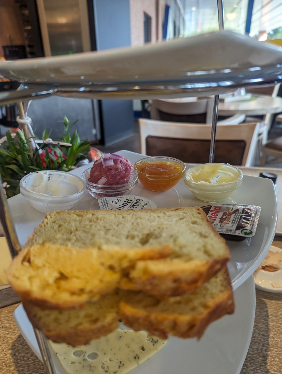 God I love Germany. I've got all the breakfast condiments. Honey, marmalade, Nutella......meat and onions