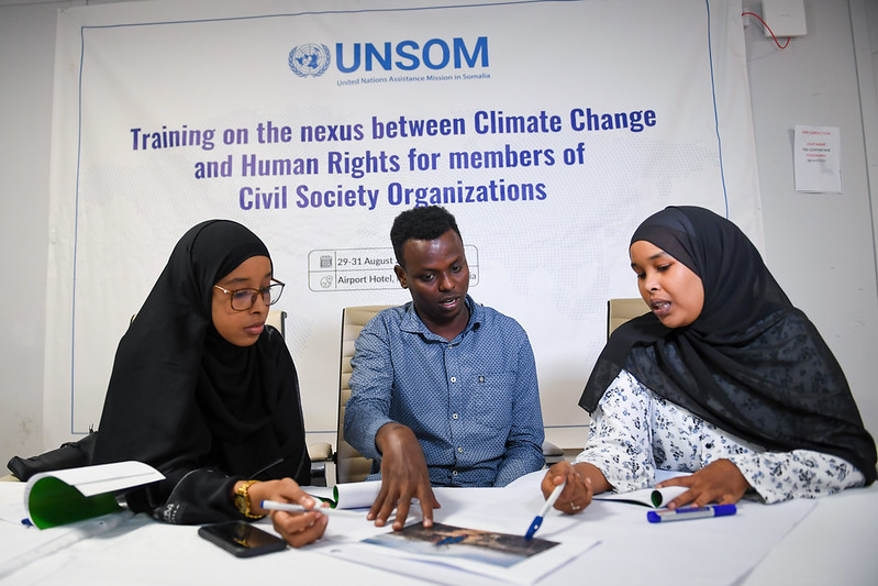 UNSomalia's tweet photo. A three-day, @UN-backed training on the links between #humanrights and #climatechange in #Somalia began today in #Mogadishu - participants examined how changing climate patterns lead to food insecurity, conflict over shrinking resources and displacement; and how climate change's consequences especially affect #women, persons with disabilities, children and marginalised groups.