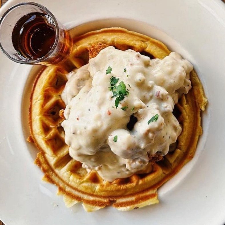 Chicken &amp; Waffle. Hot and toasty Belgian waffle with our award winning buttermilk fried chicken topped with Tamie's Slightly Spicy Sausage Gravy. Served with real maple syrup.

#chickenandwaffles #waffles #friedchicken #sausagegravy #comfortfood #brunch