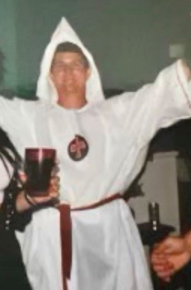 razzli_'s tweet photo. A friendly reminder that Ron DeSantis appointed a County Commissioner, Jeff Moore, who resigned last year after a picture of him wearing a KKK outfit resurfaced.

Are we surprised that Black People are being targeted in Florida a year later? https://t.co/02lGpcTBHP