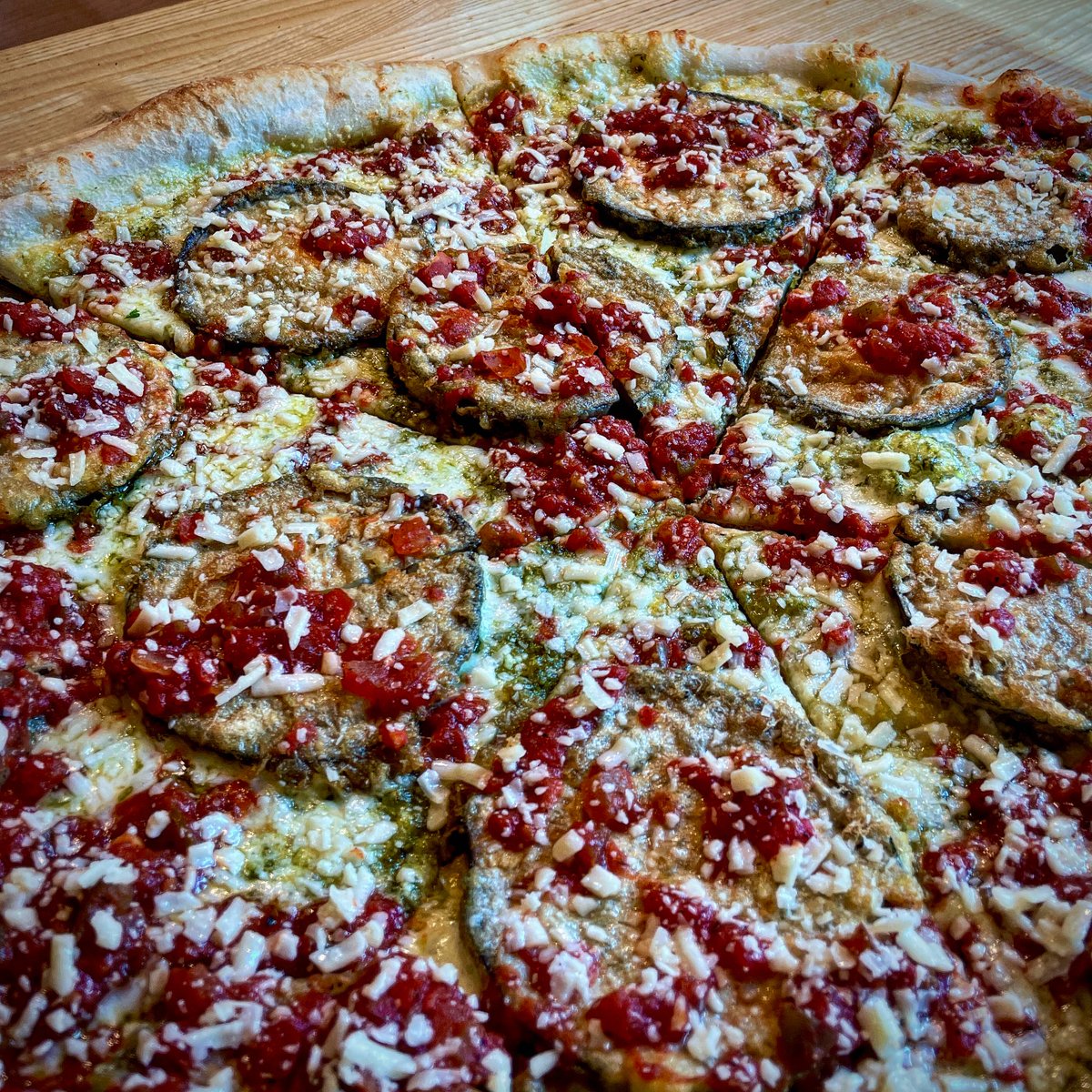 It’s a new Summer veggie slice for our weekly featured special! 🍆 ☀️ Eggplant Pesto features local eggplant, pesto, green pepper marinara, mozzarella, pecorino, and asiago! Now available through September 12th!