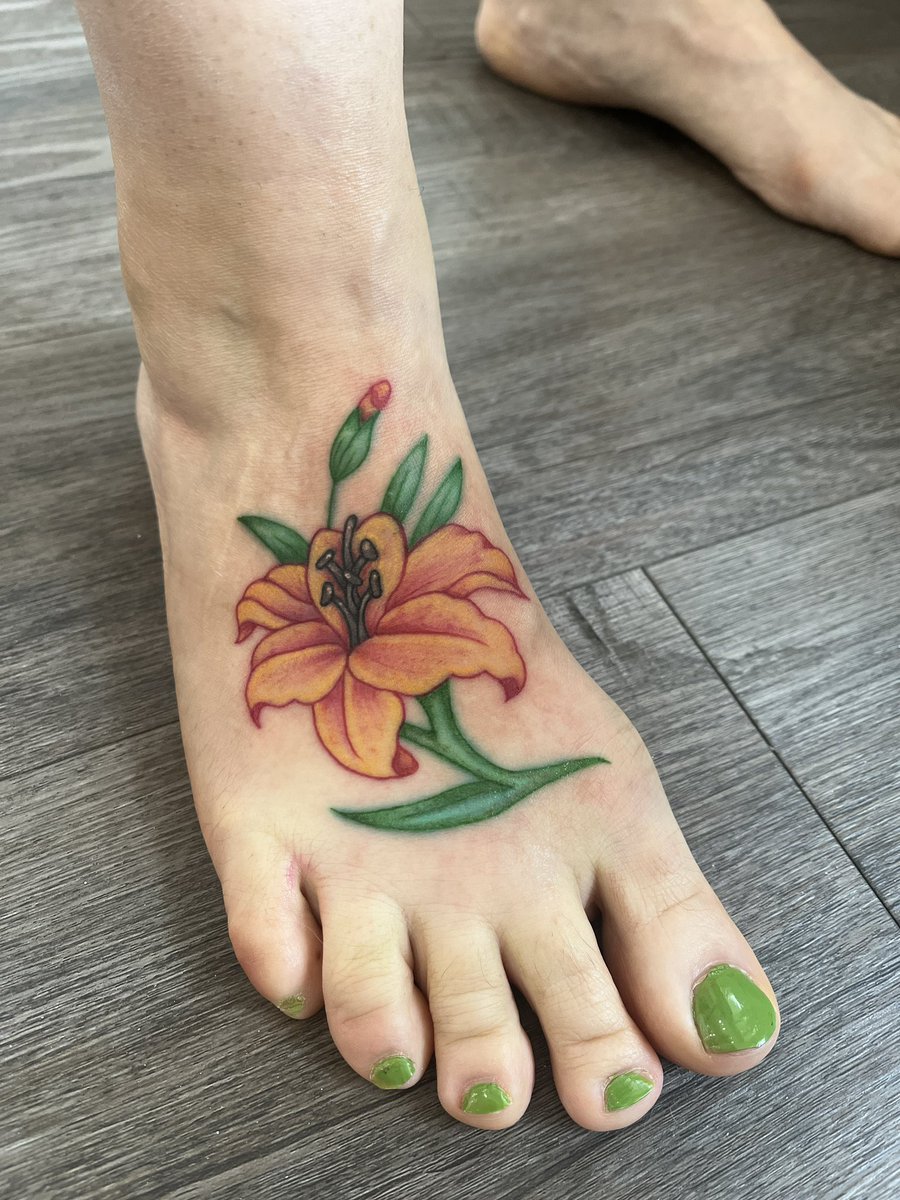 My new tattoo. A tiger and a lily, fierce and fine, and my favorite colors.