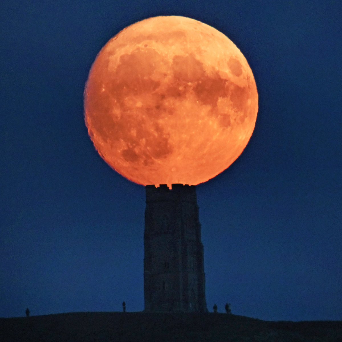 JeffOvers's tweet photo. Once in a …. The waxing #BlueMoon seemed to rest on the top of Glastonbury Tor as it rose this evening https://t.co/OFAROsVwrI