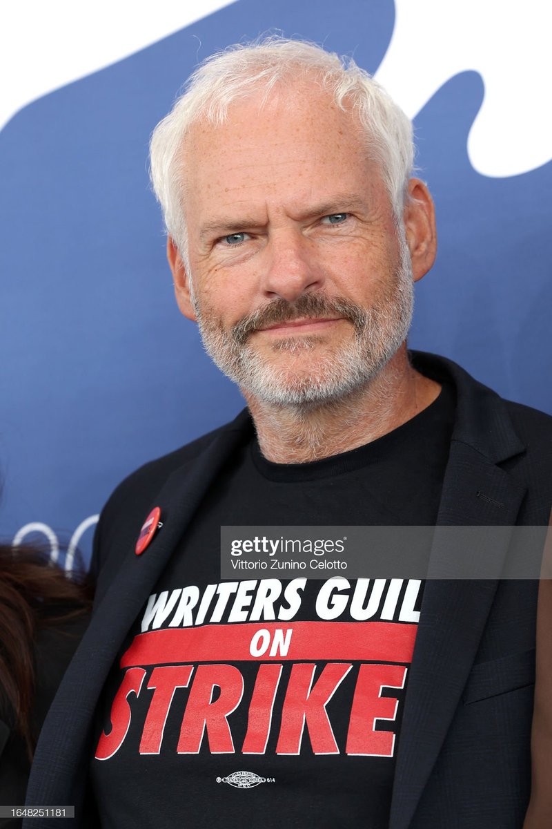 GettyVIP's tweet photo. Venezia 80 jury members #LauraPoitras, #MartinMcDonagh and Jury President #DamienChazelle wear #WritersGuildOnStrike t-shirts during #Venezia80 in Venice, Italy. I August 30, 2023 I ๐ท: Vittorio Zunino Celotto #GettyVIP @la_Biennale #BiennaleCinema2023 #WGA https://t.co/oLmFkB7RxD