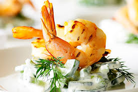 Enjoy seafood and get calcium. Leave king prawns whole in dishes, rather than chopping them, to make the most of their  attractive appearance. Serve whole king prawns cold with a delicious  dipping sauce or in a seafood salad.rroij.com/medical-and-he…