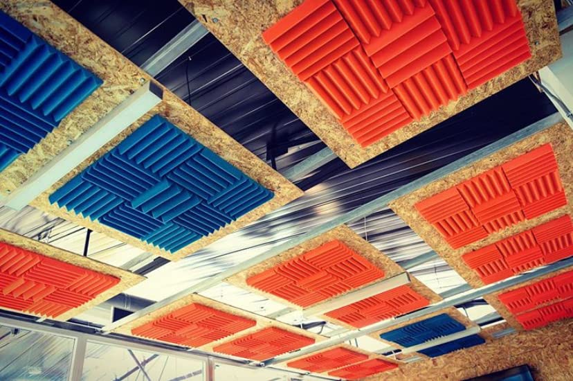 Blue and orange acoustic foam used in office space to eliminate echoes and dampen sound in the conference room! This is an image of the ceiling above the conference table. Design and install by Locus Arquitectos SA . SHOP: ow.ly/GFAm50LUHUN . #acousticpanels #acousticfoam
