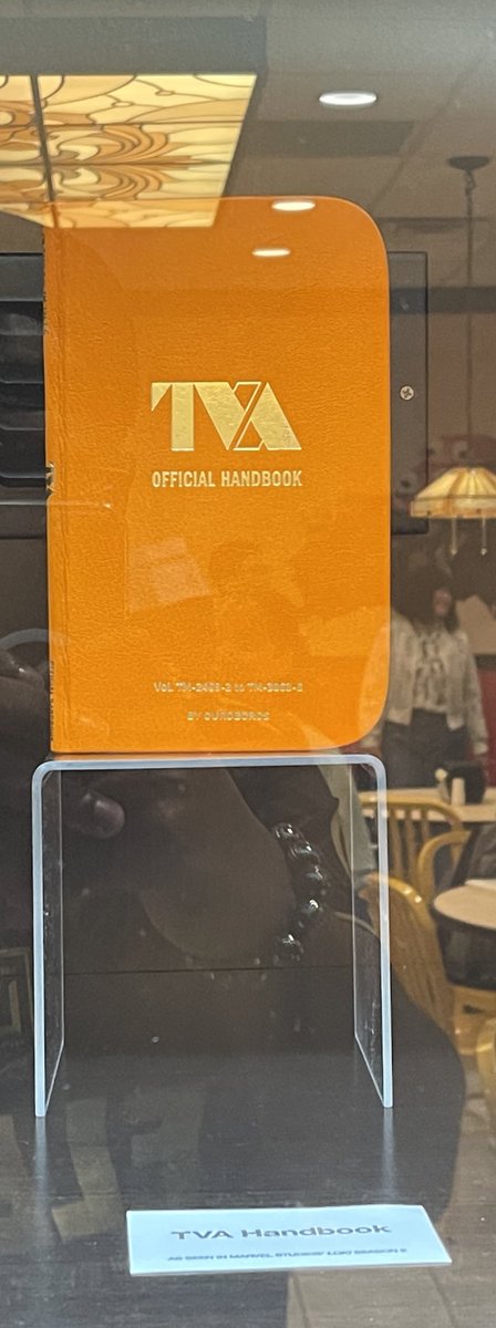 BeanzGotGamez's tweet photo. @McDonalds Photos of the TVA’s time collar, handbook and tempad on display. 

#Loki https://t.co/veHcDksZvD