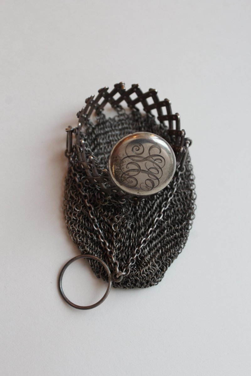 This 19th-century American sterling silver chatelaine purse is only 2.5" x 2" and was designed with an extendable accordion gate opening. The monogrammed lid with the initials “SCC” for Sarah Corbit Curtis (1871-1952) was presented to HOF by her namesake granddaughter in 2004.