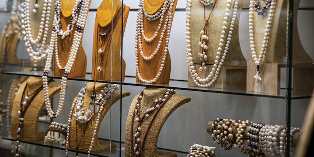 Born in Indonesia, Klara Haloho has found her calling and stays in touch with her roots by crafting pearl jewelry. Haloho sells her knotted pearl necklaces and bracelets at her Destin Commons boutique. Learn more: bit.ly/47GZNbZ. Photos by <a href="/mikefender/">Mike Fender</a>.