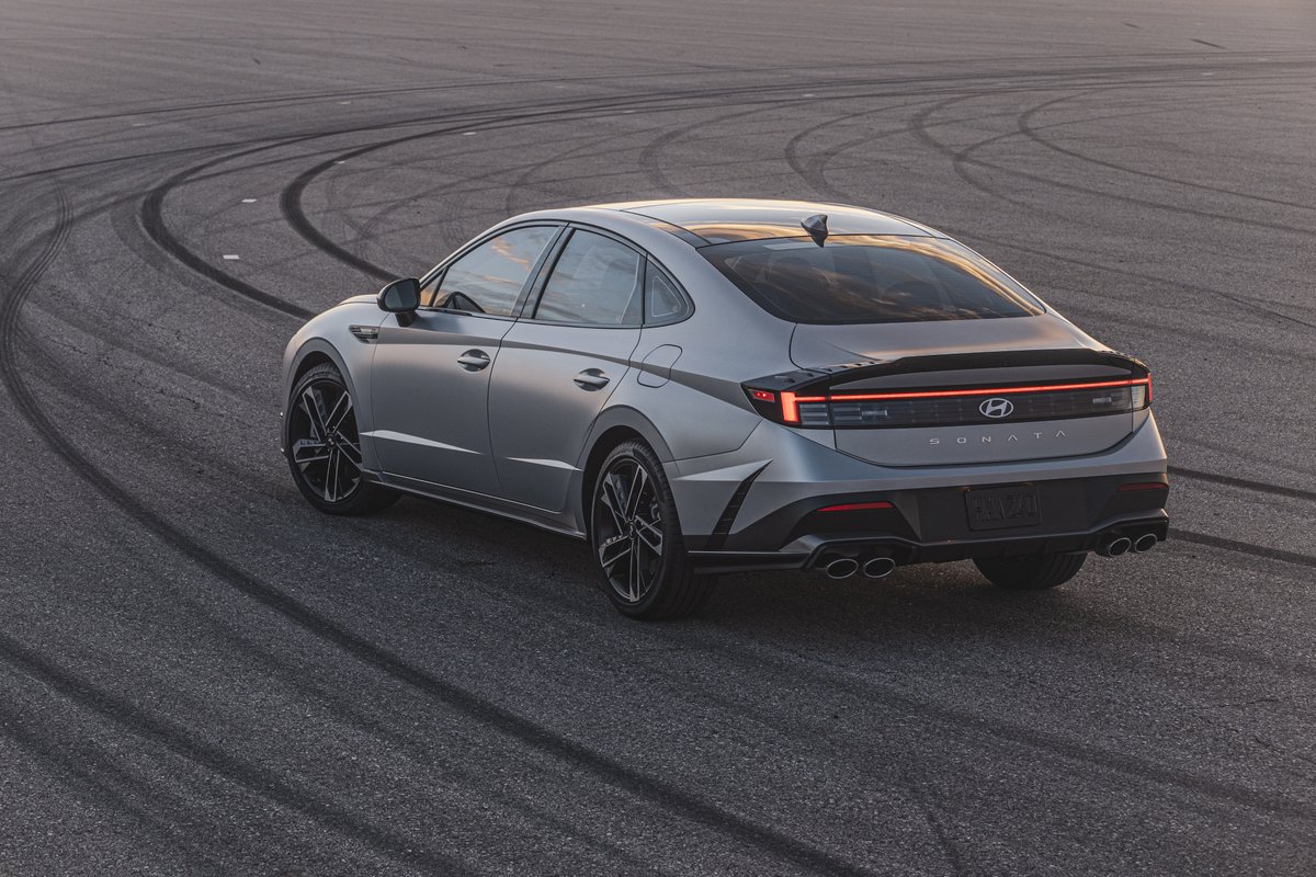 Hyundai's tweet photo. The 2024 Sonata N Line has been leveled up to emphasize its sportiness. ๐ We now have distinctive design touches like a rear spoiler garnish, a new rear bumper and new for dual twin-tip mufflers. ๐จ๐จ A view other drivers will see as the #SonataNLine passes them on the road! https://t.co/5mCRAiLNK7