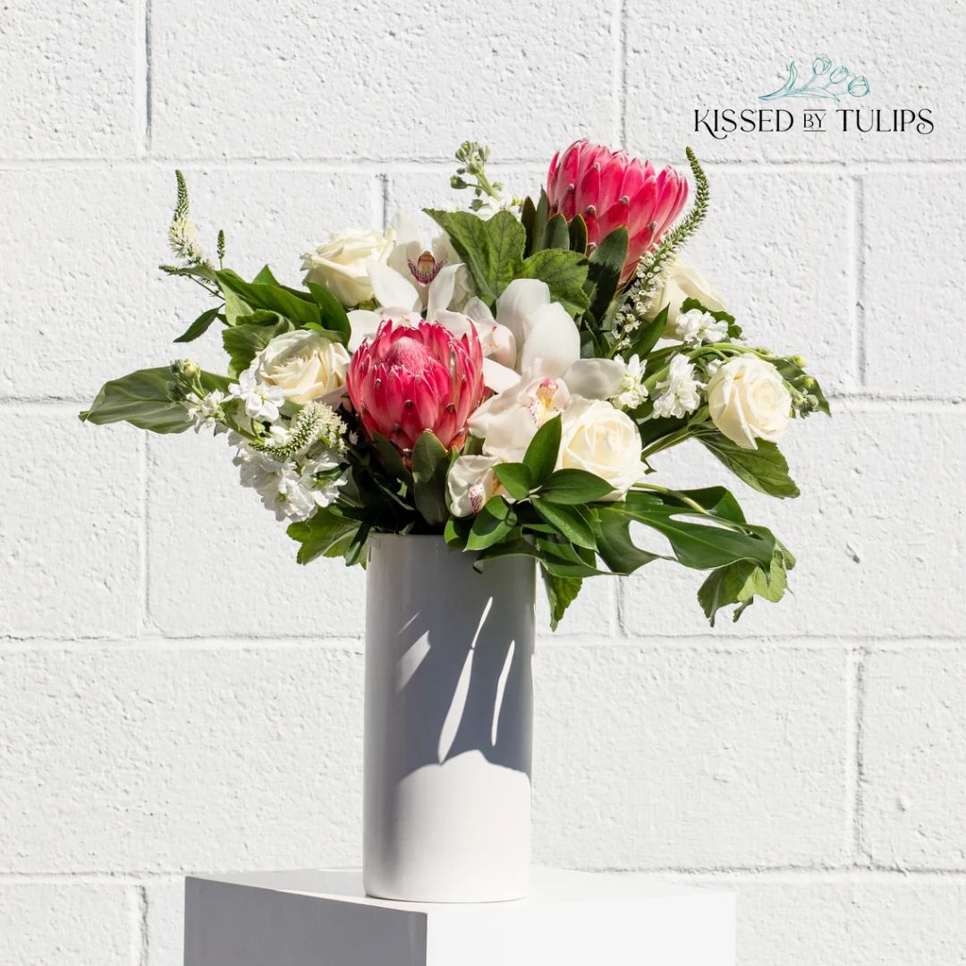 This gorgeous tropical arrangement reveals the beauty of a protea and cymbidium shubertii orchid. 
Shop Now!
kissedbytulips.com
(949) 287 6622
#blooms #flowers #datefolowers #eventflowers #eventflorist #partiesandevents #summerflowers #rosearrangement #elle #flower #nature