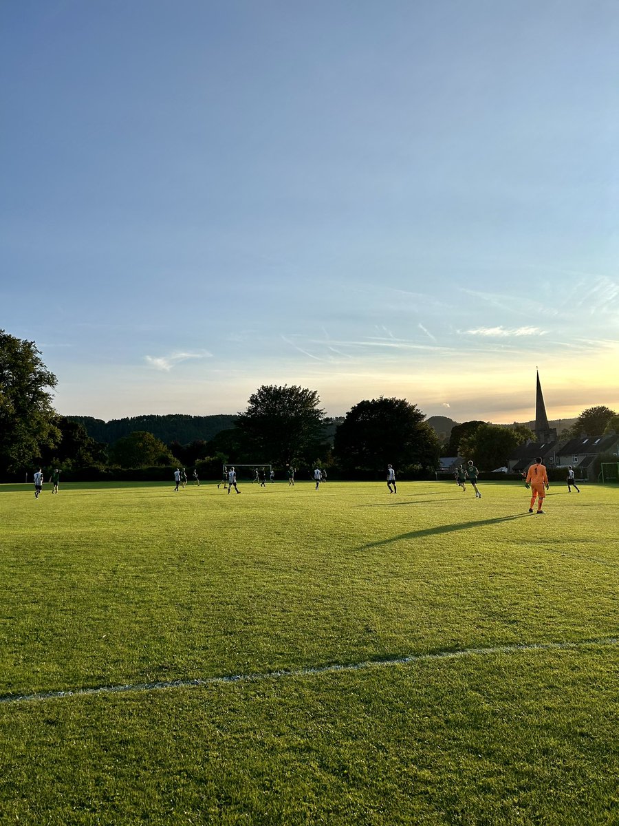 RPGilb's tweet photo. A quintessentially English, village evening in #Ashover tonight as @WirksIvanhoeFC reserves run out 9-0 winners, to the accompaniment of church bells and a brass band, with the sunset in the background #footballmatch #livefootball #NonLeague #groundhopping #Derbyshire https://t.co/phMtTr4R6l
