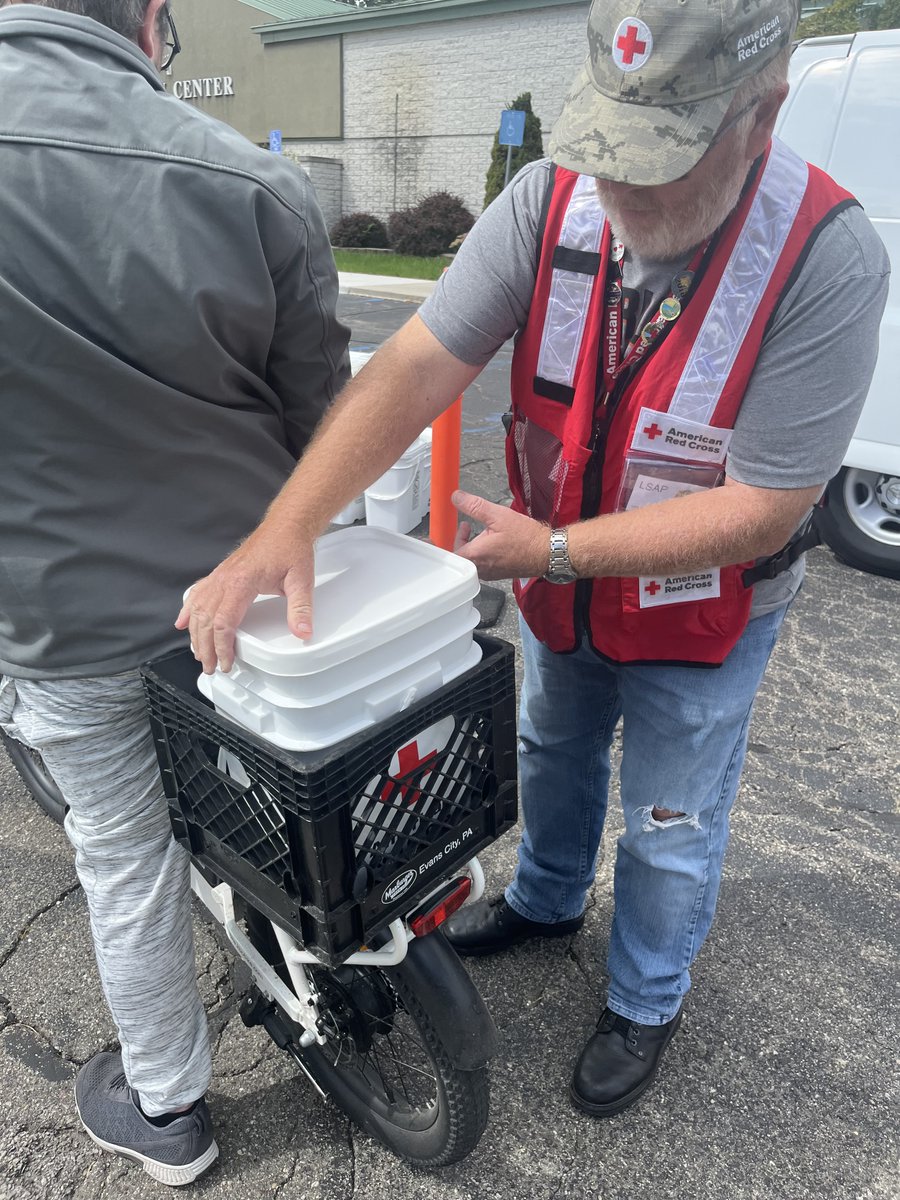 MIRedCross's tweet photo. Severe storms ripped through communities across Michigan a few days ago leaving behind debris &amp; thousands without power. Today volunteers Kevin, Franklin and many more were out to offer clean-up kits &amp; water to those who were impacted as a part of our ongoing response ⛑️ https://t.co/tNcBjyuoUR