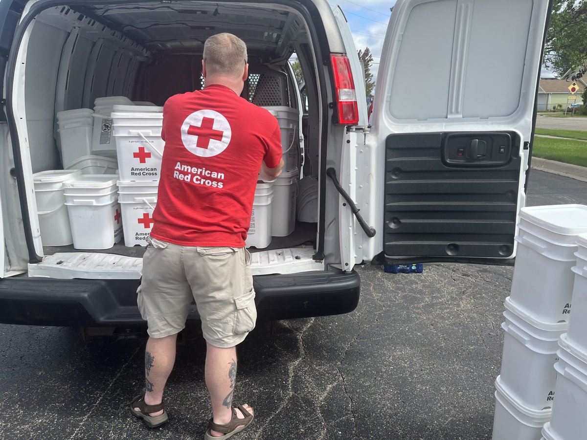 MIRedCross's tweet photo. Severe storms ripped through communities across Michigan a few days ago leaving behind debris &amp; thousands without power. Today volunteers Kevin, Franklin and many more were out to offer clean-up kits &amp; water to those who were impacted as a part of our ongoing response ⛑️ https://t.co/tNcBjyuoUR