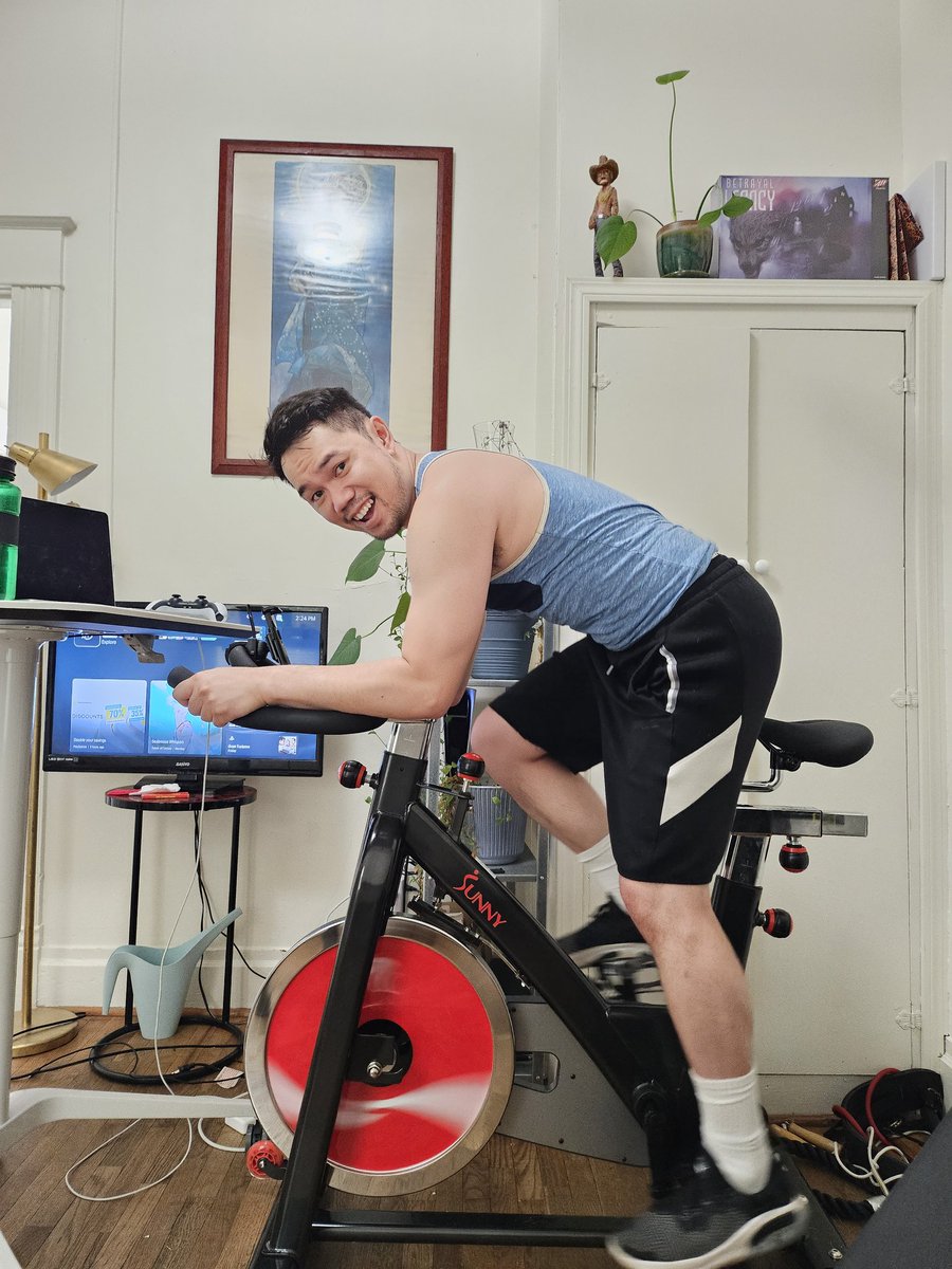 queerapollo's tweet image. This is the Sunny stationary bike I use. Highly recommended! Pardon my work/video game set up/mess