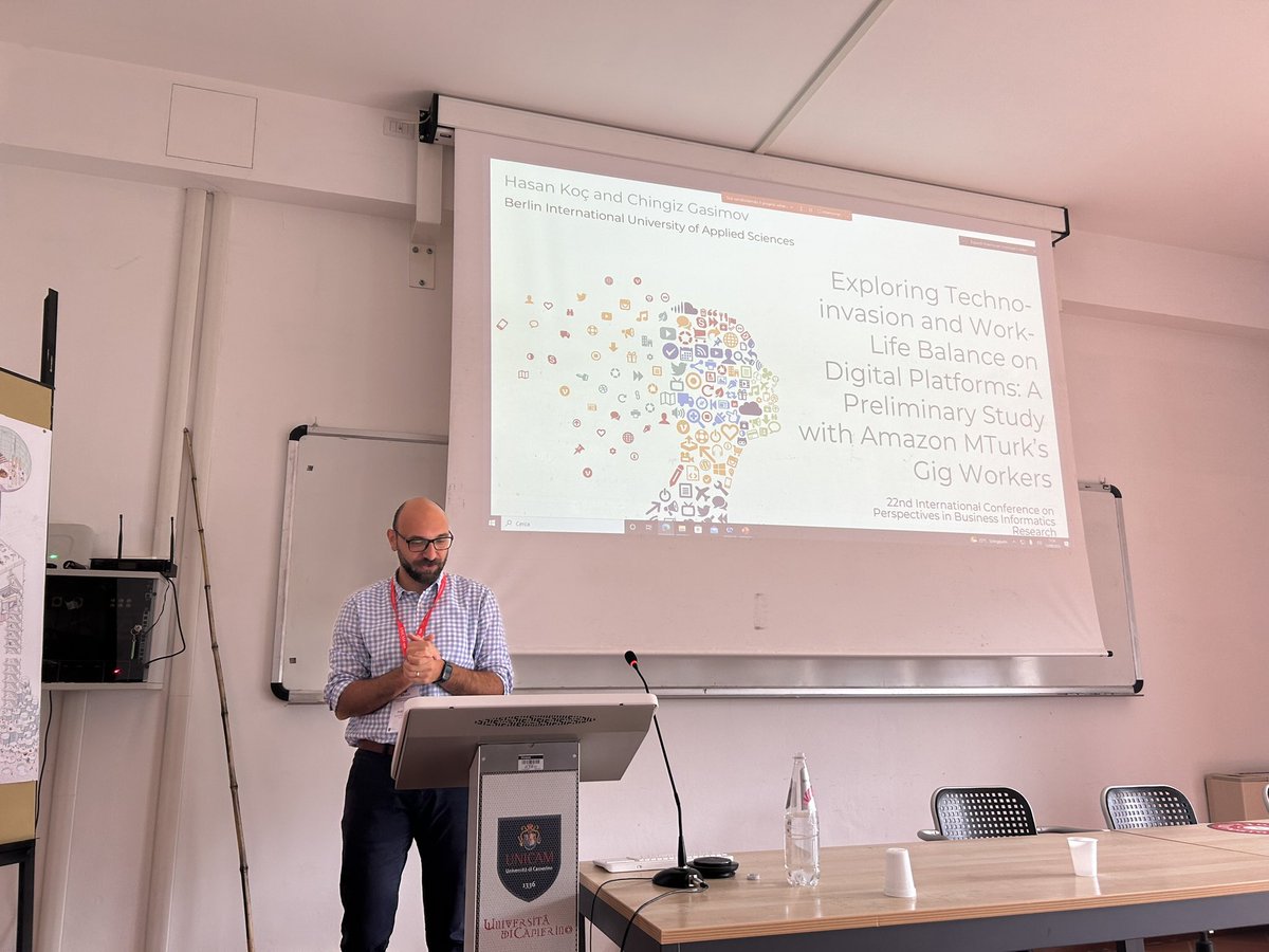 Hasan Koç presenting the paper titled “Exploring Techno-invasion and Work-Life Balance on Digital Platforms: A Preliminary Study with Amazon MTurk’s Gig Workers”