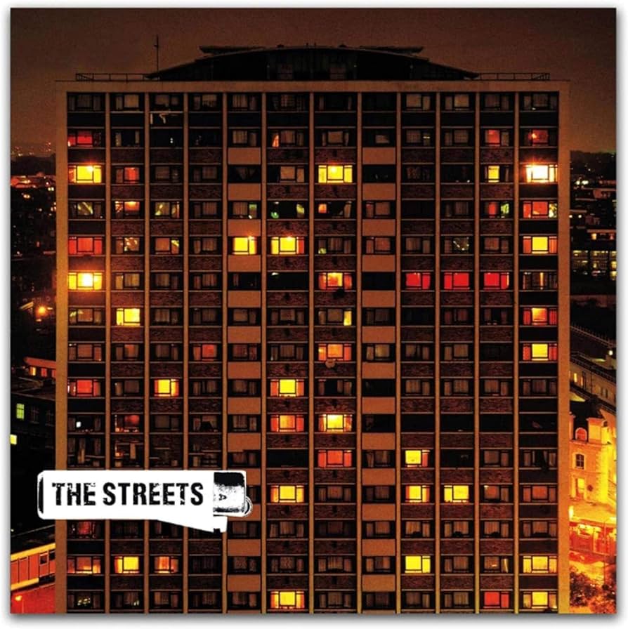 #AlbumArt15
Day 12

Original Pirate Material - The Streets

I've always found this really nostalgic. A couple of my first homes were in towerblocks, and the warm glow from the lights in this photo remind me of visiting my nan's flat in Enfield. 
'Don't pull that orange cord!'