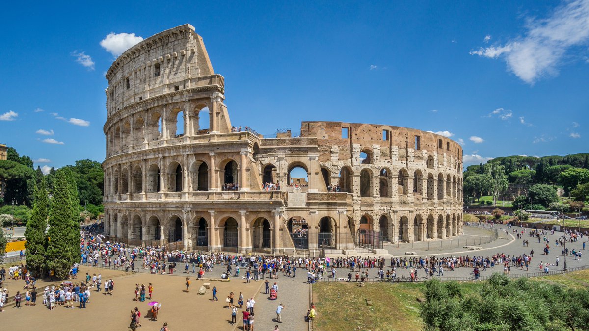 Historyinthrds's tweet photo. The Colosseum is an elliptical amphitheater located in the center of Rome, Italy, just east of the Roman Forum. 

It is the largest ancient amphitheater ever built and is still the largest standing amphitheater in the world. Construction began under the emperor Vespasian in 72 AD and was completed in 80 AD under his successor and heir, Titus. 

Today, the Colosseum is a major tourist attraction in Rome with thousands of tourists each year entering to view the interior arena. There is now a museum dedicated to Eros in the upper floor of the outer wall of the building. Part of the arena floor has been reinstated, and beneath the Colosseum, a network of subterranean passageways once used to transport wild animals and gladiators to the arena opened to the public in summer 2010. 

Here are some interesting facts about the Colosseum:

- The Colosseum is the largest amphitheater ever built, and is still the largest standing amphitheater in the world.
- The Colosseum was originally known by its official name, the Flavian Amphitheater.
- The Colosseum was built between 70 and 72 AD and was enjoyed by Roman citizens during the height of the Roman Empire.
- The Colosseum is believed to derive its name from the amphitheater's proximity to the Colossus of Nero, a huge bronze statue that once stood nearby.
- In 2007, the Roman Colosseum was chosen as one of the ‘New Seven Wonders of the World’.
- The Colosseum wasn’t only a combat arena, but over its 2000-year history, it has been used as a cemetery, as housing for Rome’s poor, and as a fortified castle of a powerful Roman clan.
- The building’s architecture is a medley of the three most important Roman orders, Tuscan, Ionic, and Corinthian, and it is full of little details that attest to the ingenuity of those who built it.

The Colosseum is a fascinating piece of history that attracts millions of visitors every year.
