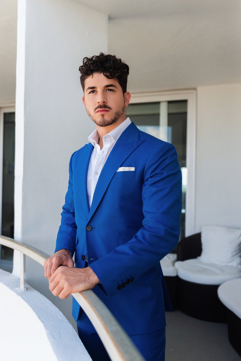 Impeccably dressed in head-to-toe @NasirSuits @TwoTrends Sebas is wearing a custom Marine Blue suit with custom wide lapel. SuitUp and get the look today. Now taking in person consultations in the South Florida area. Book your appointment today. nasirsuits.com