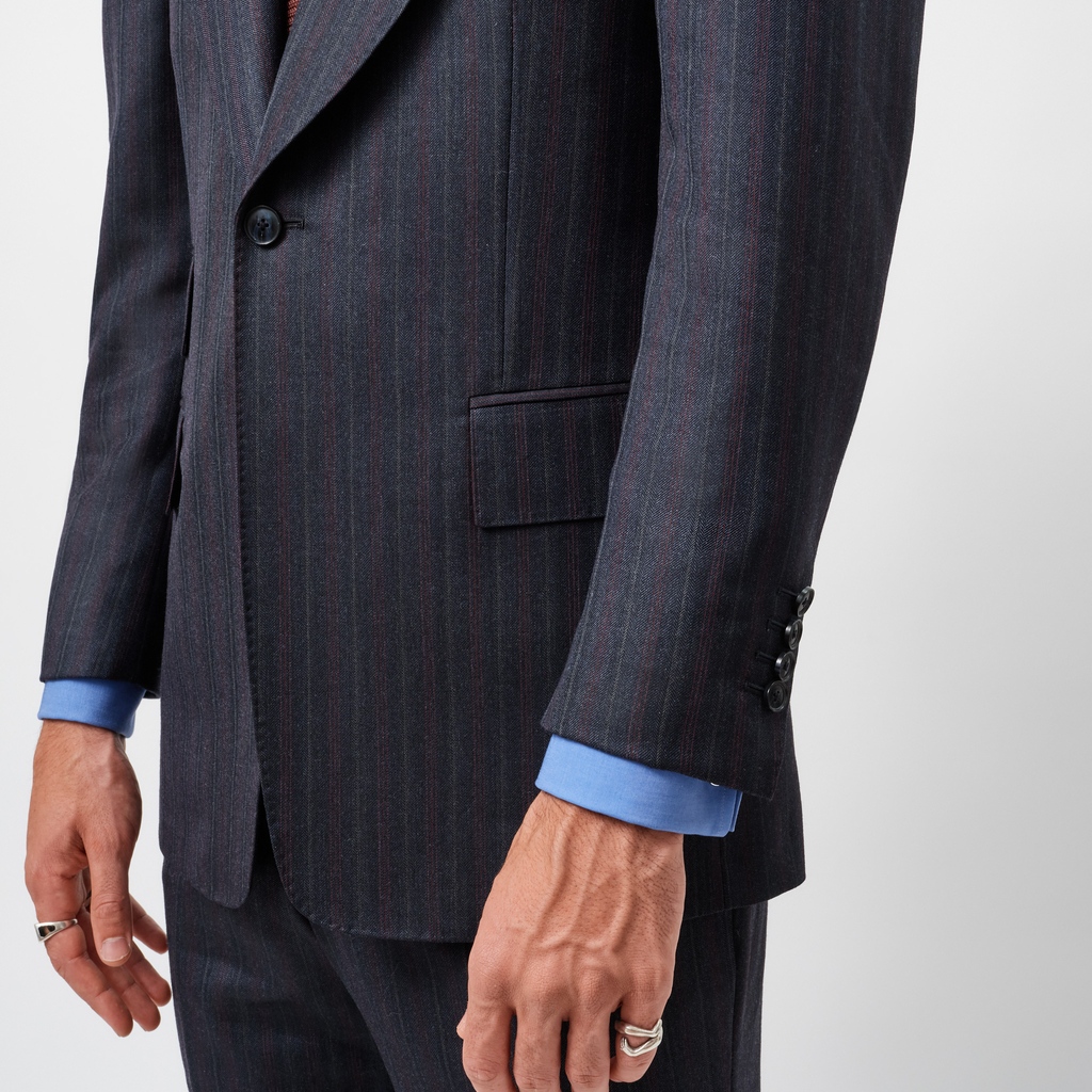 It can’t be an Edward Sexton collection without a nod to the past. This suit, made in a striking navy, burgundy and grey multi-stripe screams retro, and the classic Sexton cut gives it the edge that makes it that much more special: edwardsexton.co.uk.